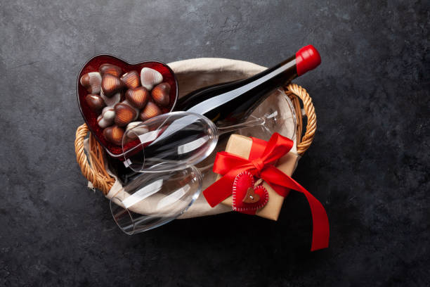 Valentines day basket with wine and chocolate. Top view flat lay